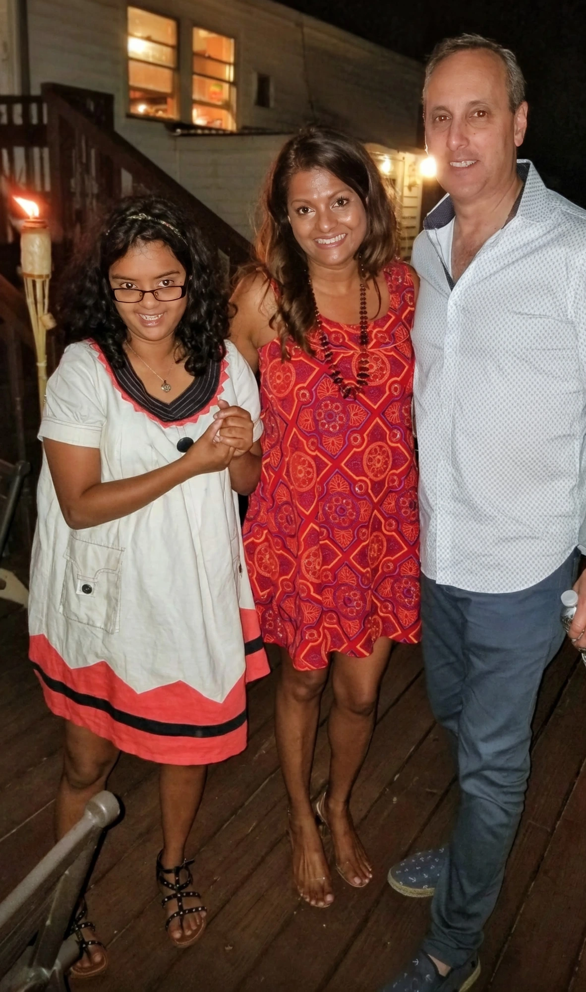 Danielle with her mother Rebecca and family on the back deck.